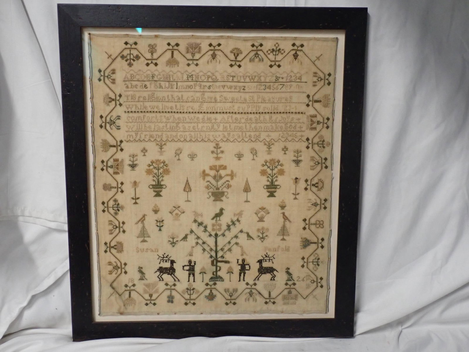 1826 Susan Penfold Sampler: 1826 Susan Penfold Religious verse, Alphabet Numbers Motif Adam and Eve, birds, trees, stags, flowers and urns Vince and geometrical flower border. Frame 18 3/4" x 16 1/2" Sampler 15 3/4" x 13 1/2"