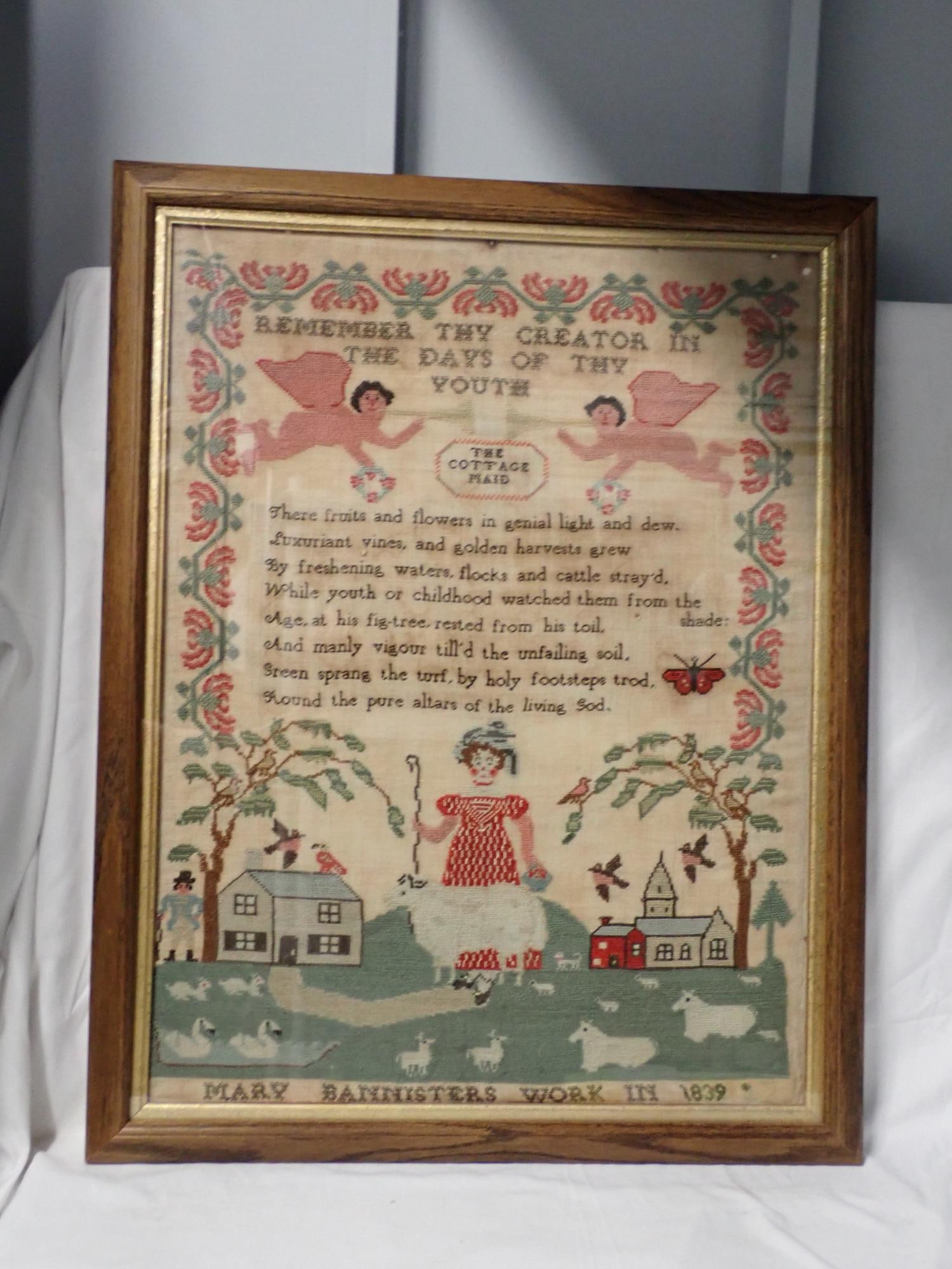 1839 Mary Bannister Sampler: Mary Bannisters work in 1839. Titled Remember Thy Creator in the Days of Youth. Verse in center- the Cottage Maid. Motif cherubs, village scene at bottom with girl with Staff. Swans, animals