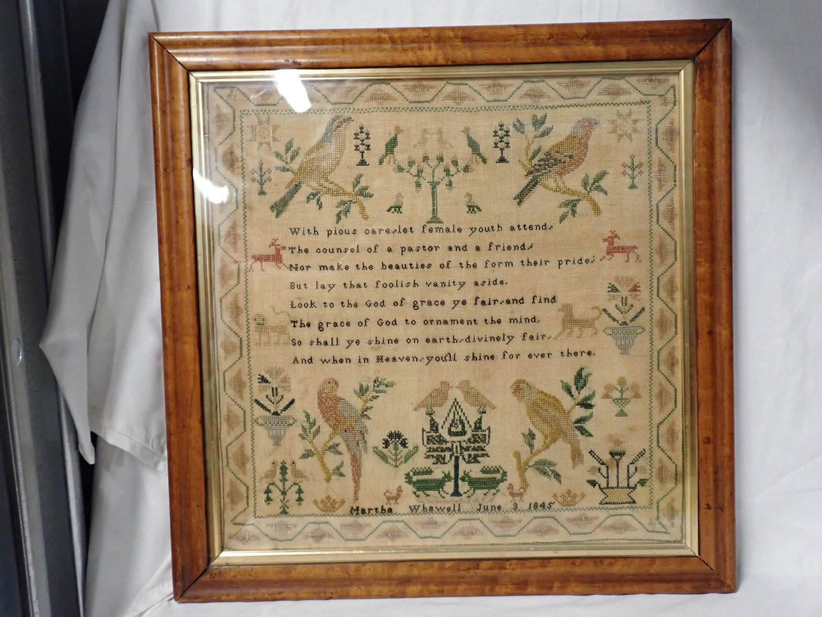 1845 Martha Whawell Sampler: Martha Whawell June 3 1845. Religious verse in center Motif Birds animals. Geometric border. Some slight staining. Frame 20 1/2 x 20 1/4 Sampler 16 1/2 x 16 1/2