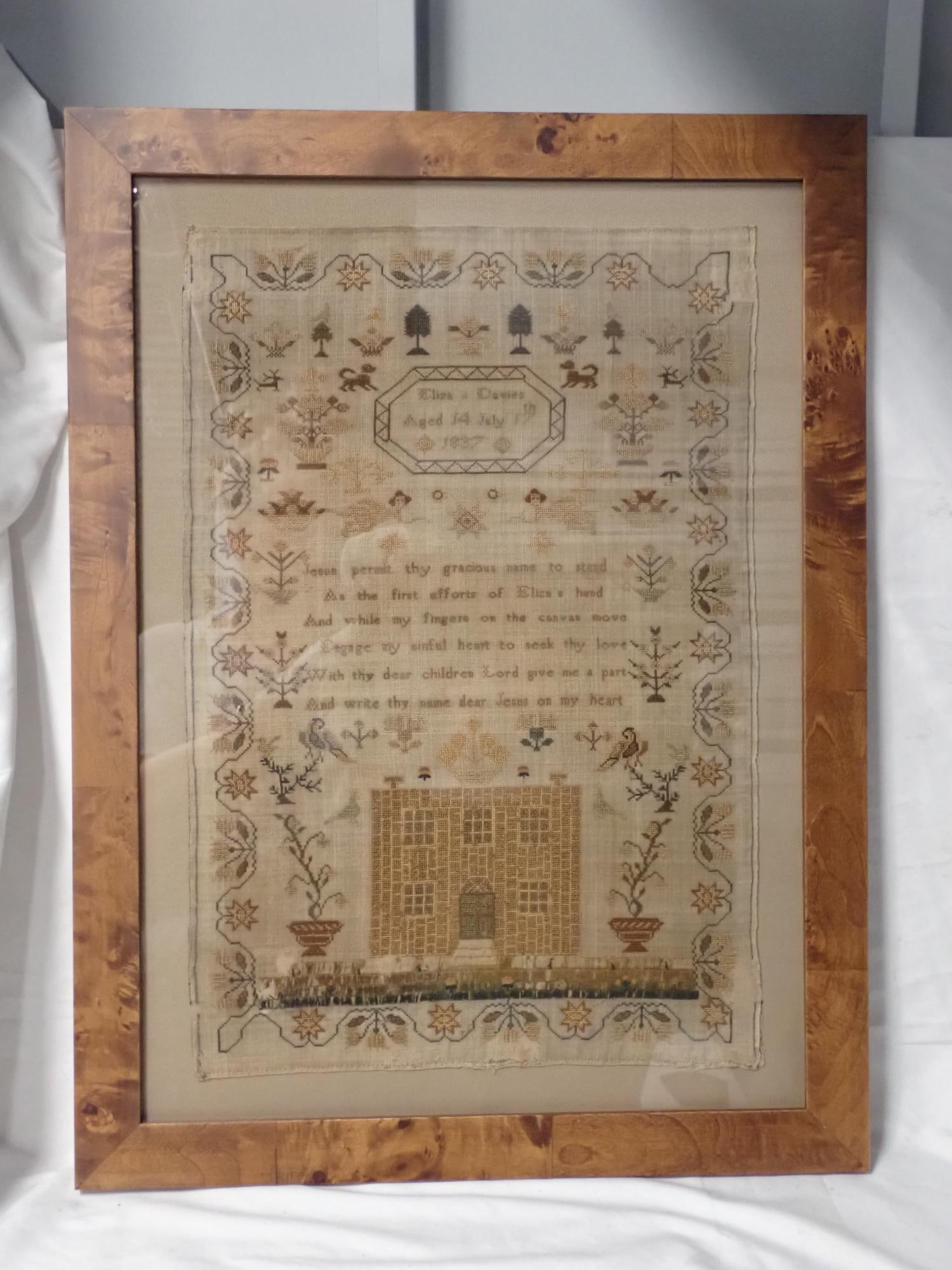 1837 Eliza Davies Sampler: Eliza Davies Aged 14 July 17th 1837. Religious verse in center. Motif flowers trees, animals Fabric loss and discoloration, some thread loss Frame 25 x 18 1/2 Sampler 17 x 13 1/4