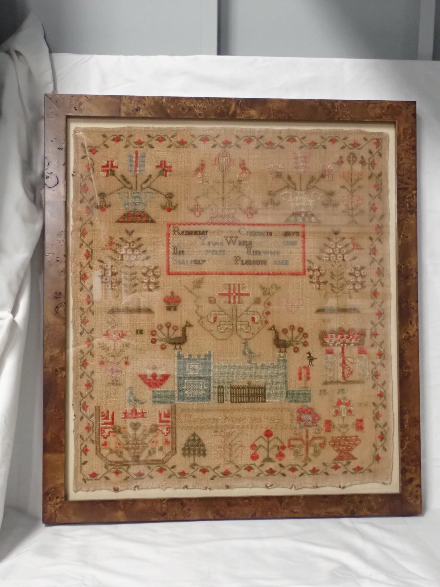1865 Margaret (?) Sampler: Margaret (?) Religious verse in center. Motif birds, flowers, peacocks urns, building. Vine and floral border. Some fabric loss and discoloration. Frame 22 x 19 1/2 Sampler 19 x 16 1/2