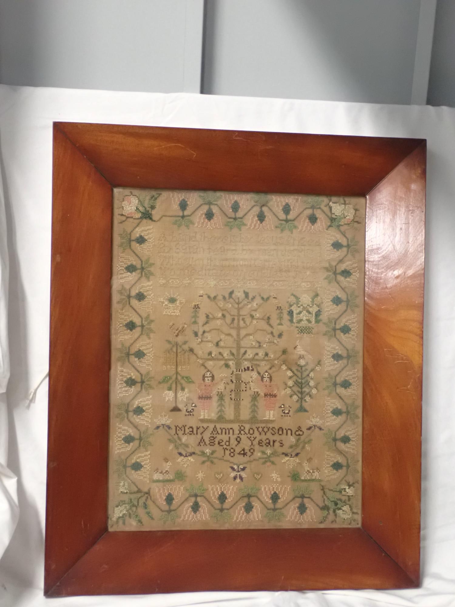 1849 Mary Ann Rowson Sampler: Mary Ann Rowson aged 9 1849. Religious verse at top. Motif Adam and Eve flowers baskets, animals and birds. Vine and floral border Thread fading . Frame 22 1/2 x 18 1/2. Sampler 17 x 12 3/4