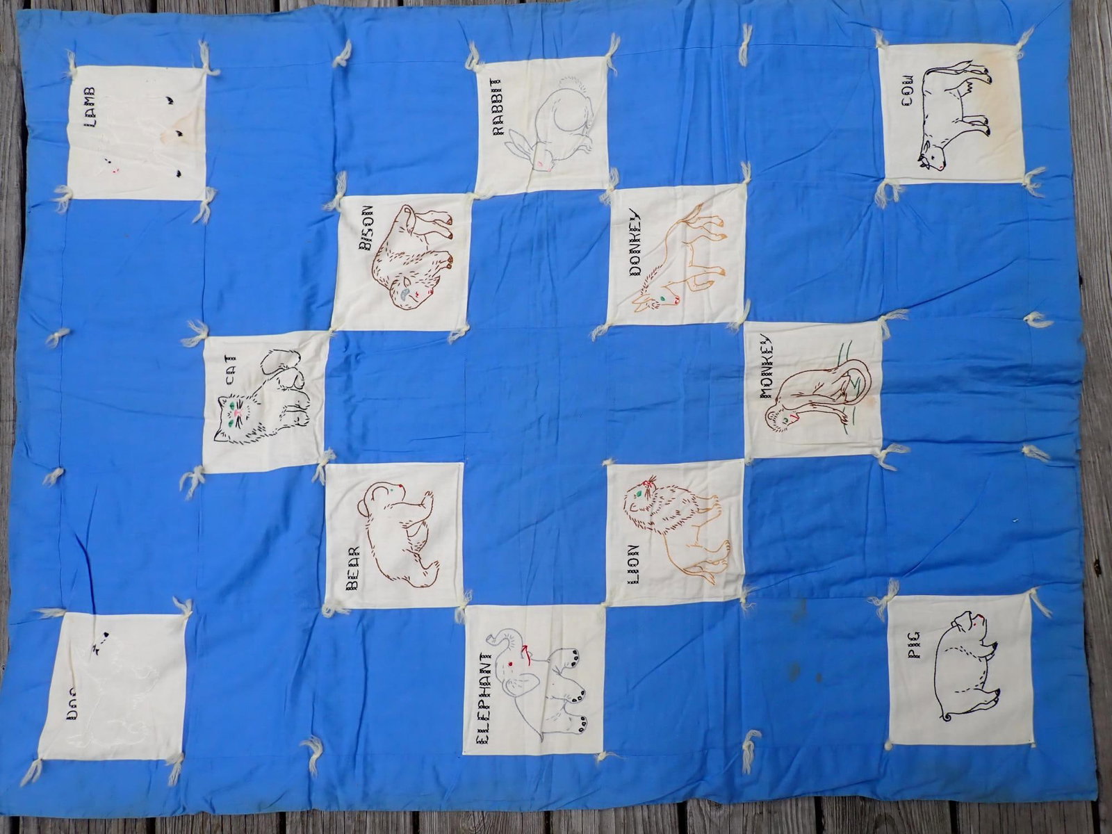 Quilt - Child's Animals 1925 - 1950: Appr. 46" x 34". Some staining. Dog and Lamb were stitched with white thread and don't show up as much as other animals.