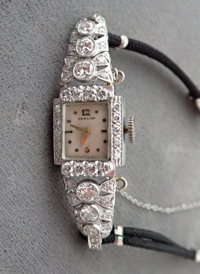 Hamilton Platinum and Diamond Watch: Hamilton Platinum Marked 10 % IRID Platinum. Band Marked - Gemex 1/20 12KT G.F. Diamonds - Diamonds are possibly made from a bracelet. Chain is GF. Platinum and Diamonds