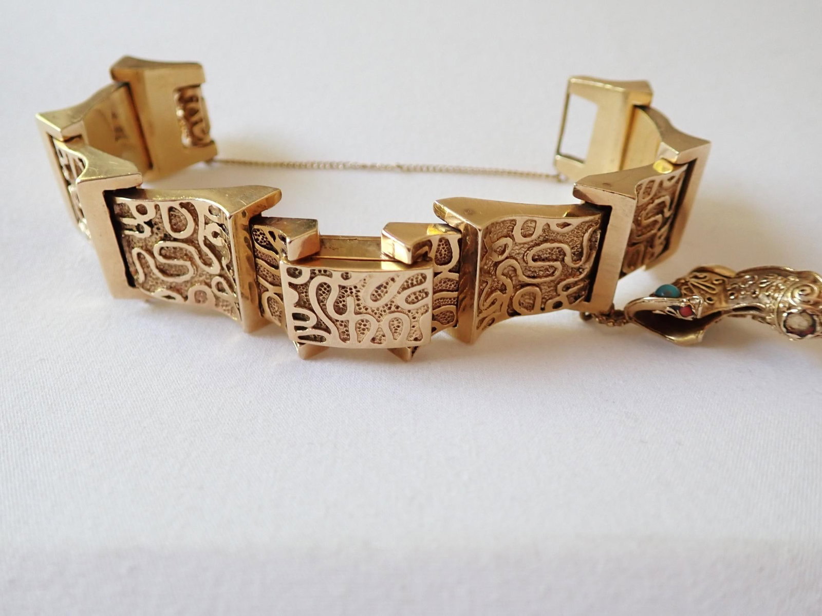 14K Women's Ornate Wristwatch - 98.7 Grams: 14K with boot charm with turquoise stone. Face has wear and watch doesn't run.