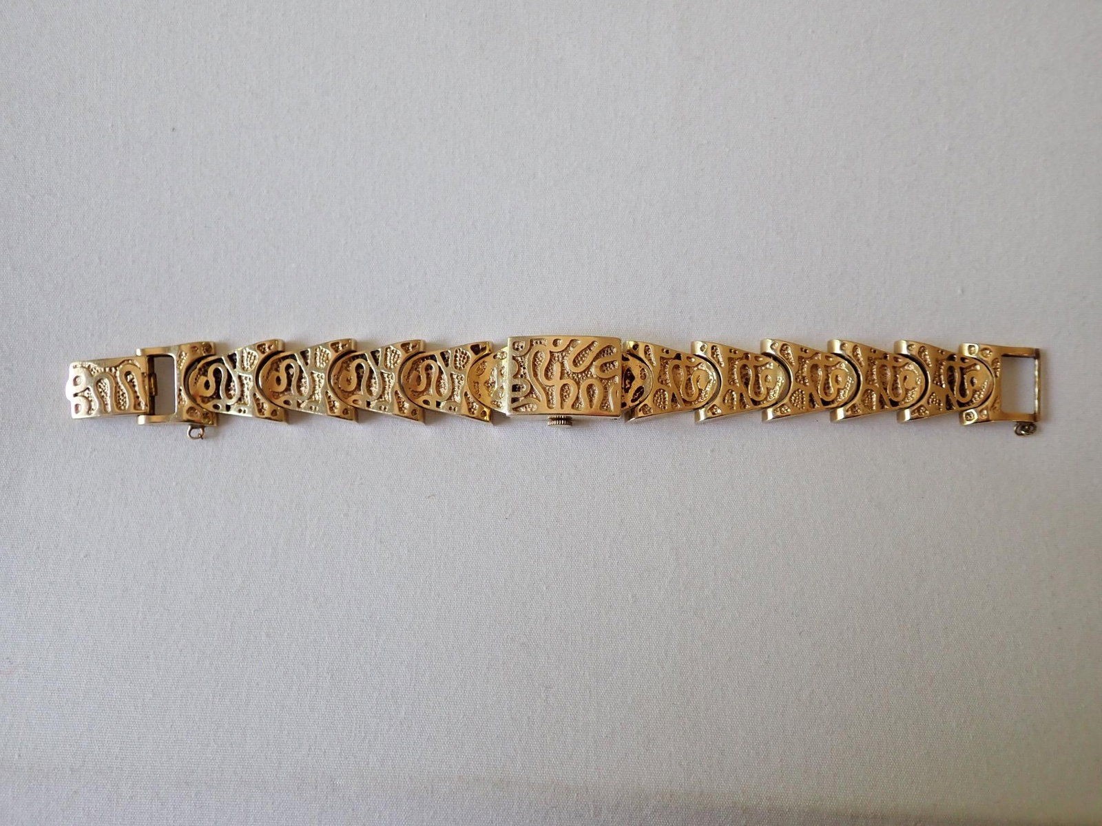 Jules 14K Watch with 14K Band - 59.4 Grams: Smaller band that lot 265 but similar watch. 14K. Marked "Jules." Watch face shows wear and watch doesn't run.
