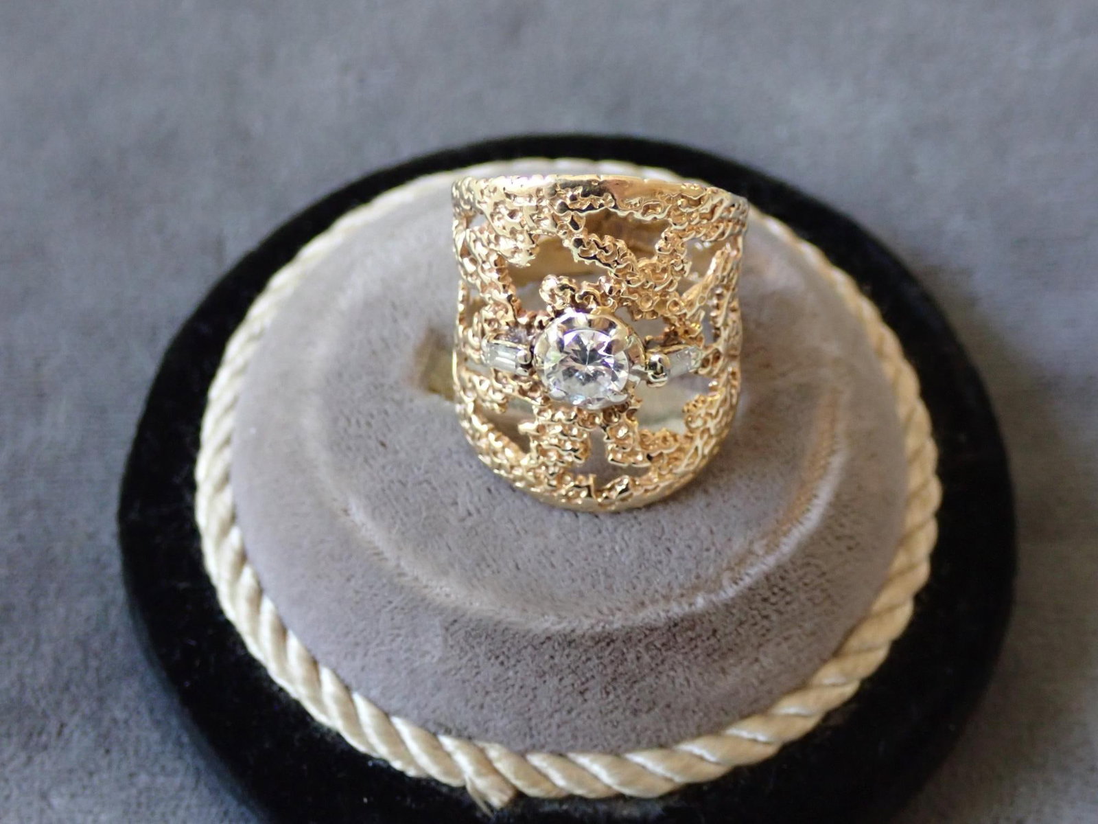 14K and Diamond Ring: 1 cracked baguette - 7.6 grams - size will be added
