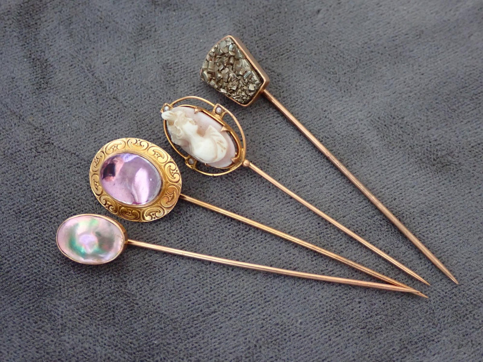 10kt, Pyrite, glass purple, blister pearl and cameo stick pins: 4.7 Grams