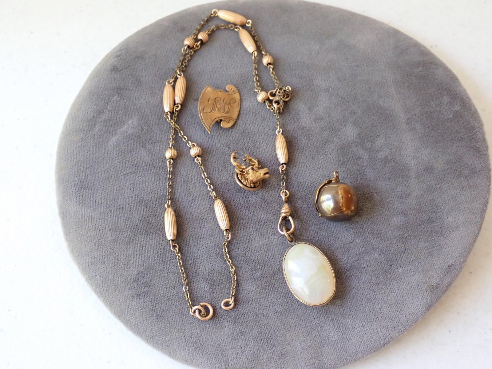 Gold Filled Watch Fob and Other Jewelry: Watch fob with pendant, moose pin, round monogrammed pin and pendant that opens to be a cross. See pictures for engraved marks on round pendant.