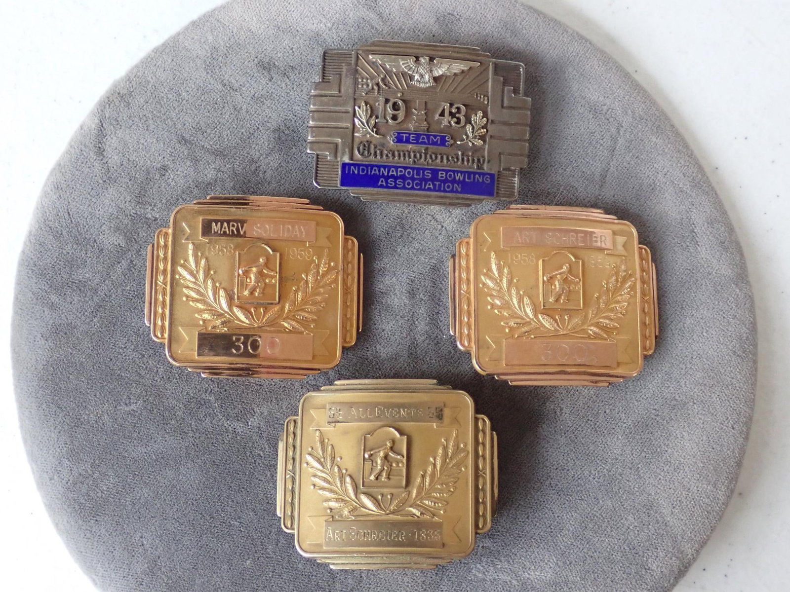 (3) 1/20 10K Gold Filled & 1 Sterling Bowling Rewards Buckles: 142 Grams. 1/20 10K Mark on back. Sterling one is 1.6 ounces. Buckles say: Marv Soliday 300, Art Schreier 300 and 54 All Events 55. Sterling one says 1943 Team Indianapolis Bowling Association. Has