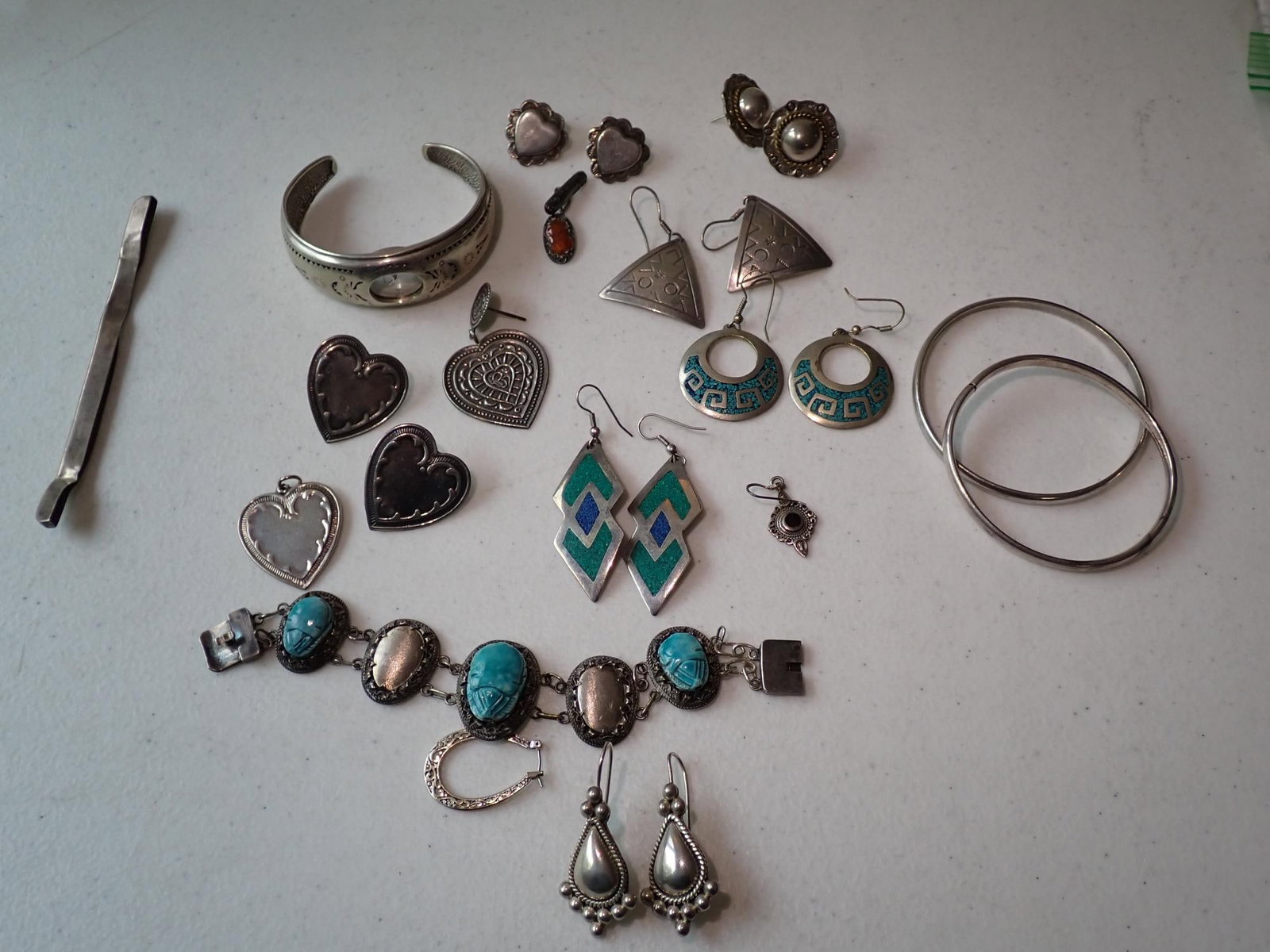 Sterling Silver Turquoise & Other Jewelry: Beetle Bracelet 7" missing stones, 7 Pairs of Earrings, 1 Heart Pendant, 2 Bracelets. 1 marked Bojor Sterling, 1 watch, Sterling Quartz with Cuff and Other Sterling. Weighed with Stones + glass beads 