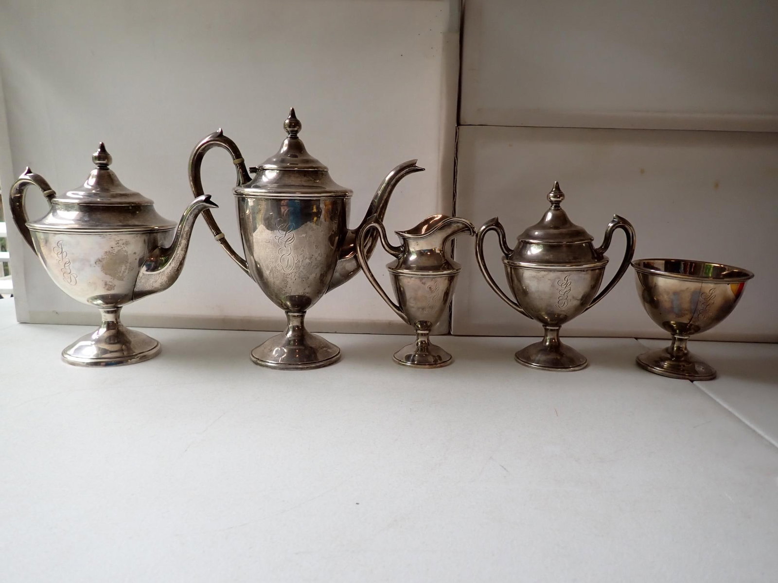 Sterling Coffee, Tea, Creamer and Sugar Set: Coffee 10", Tea 8 1/2", Sugar 1/2" and Creamer 6". Monogrammed. Footed Bowl 4 3/8".- 72.3 troy ounces