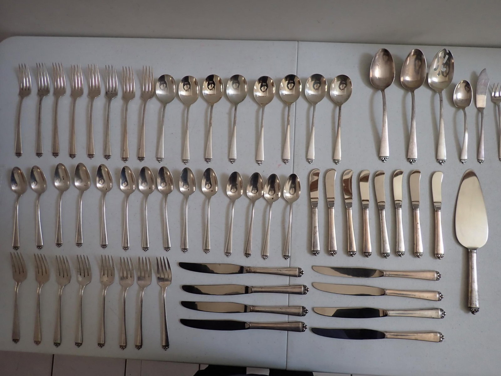 Reigning Sterling Flatware Set: 44.4 troy ounces. Weighed without knives