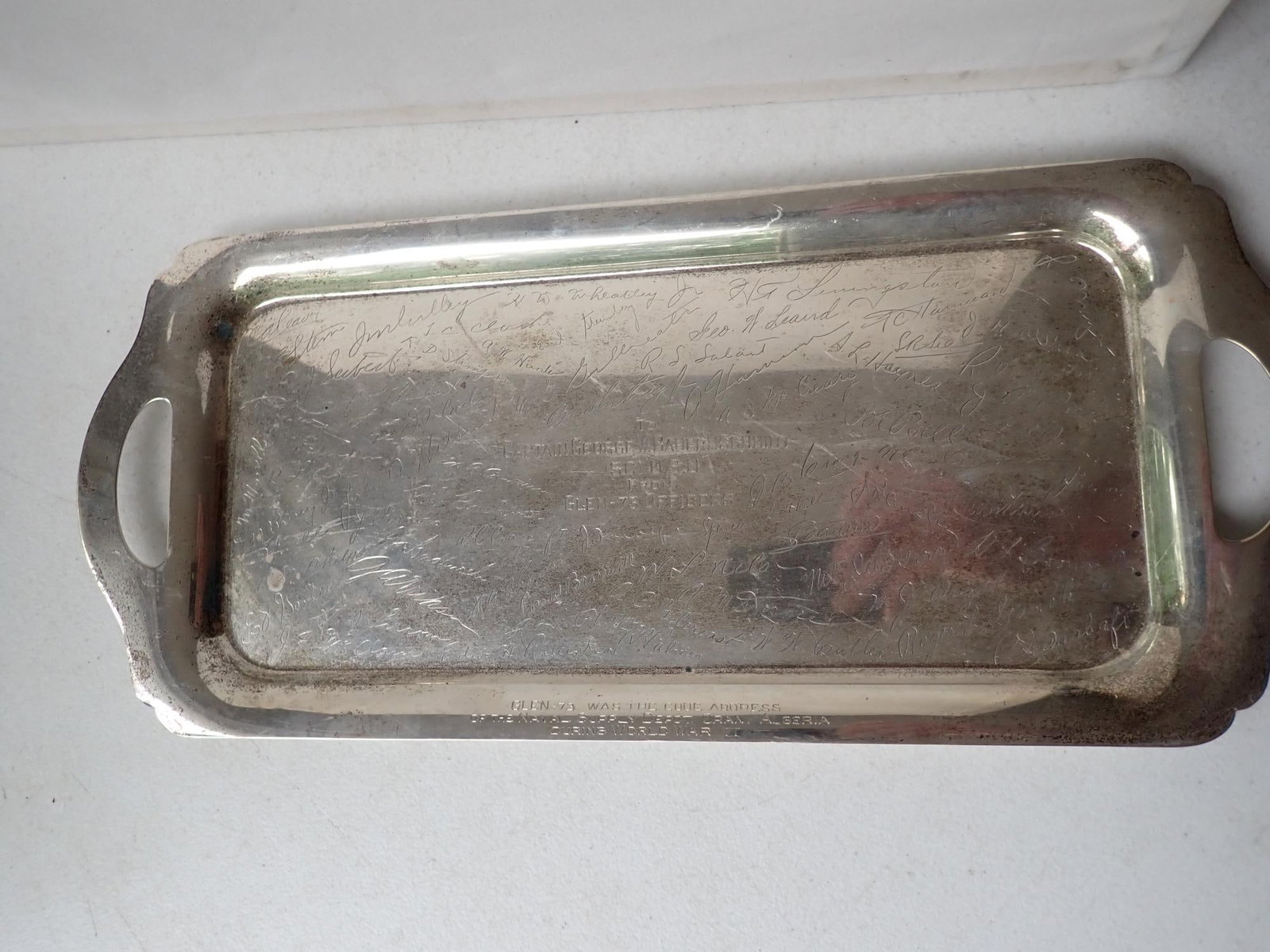 WWII Sterling Presentation 2 Handled Tray: England?? Presented to Captain George W. Bauernschmidt SC USN from Glen 73 Officers. Glen 73 was the code address of the Naval Supply Depot Oran, Algeria During WWII. The officers signatures are