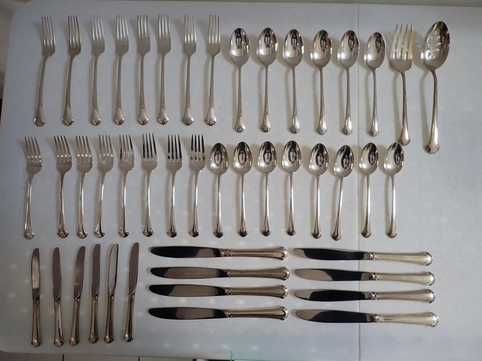 Towle Chippendale Sterling Flatware Set: 36.6 troy ounces. Weighed without knives