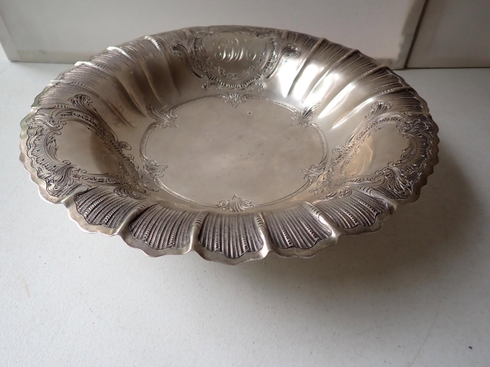 Spaulding & Co. Sterling Footed Bowl: 20th Century. Hand Chased Details. Inscribed "George III Period". Appr. 33 Troy Ounces 12 3/8" diameter by 3 1/8 High.
