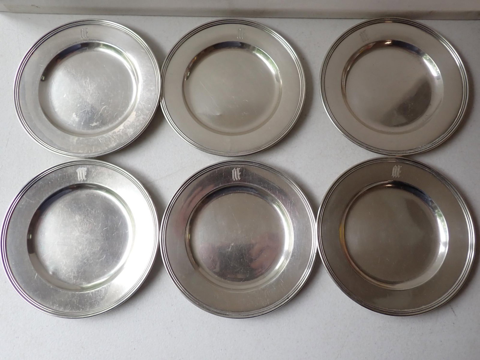 (6) Sterling 6" Plates JS Co. H413: Monogrammed M.P.B. 14" x 10." 14.1 troy ounces.