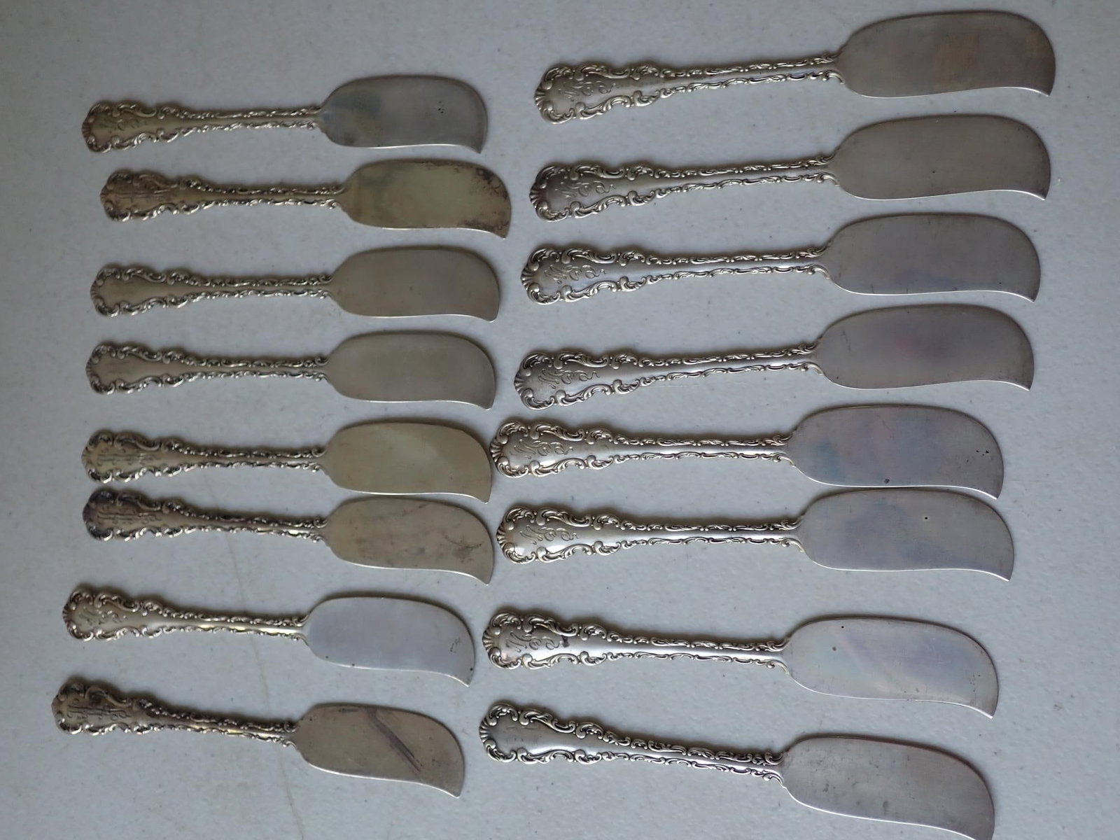 16 Whiting Gorham Louis XV Sterling Butterknives: 5 3/4". 10 are marked Pat. 1891 Wright, Kay & Co. Monogrammed. 10.3 troy ounces.