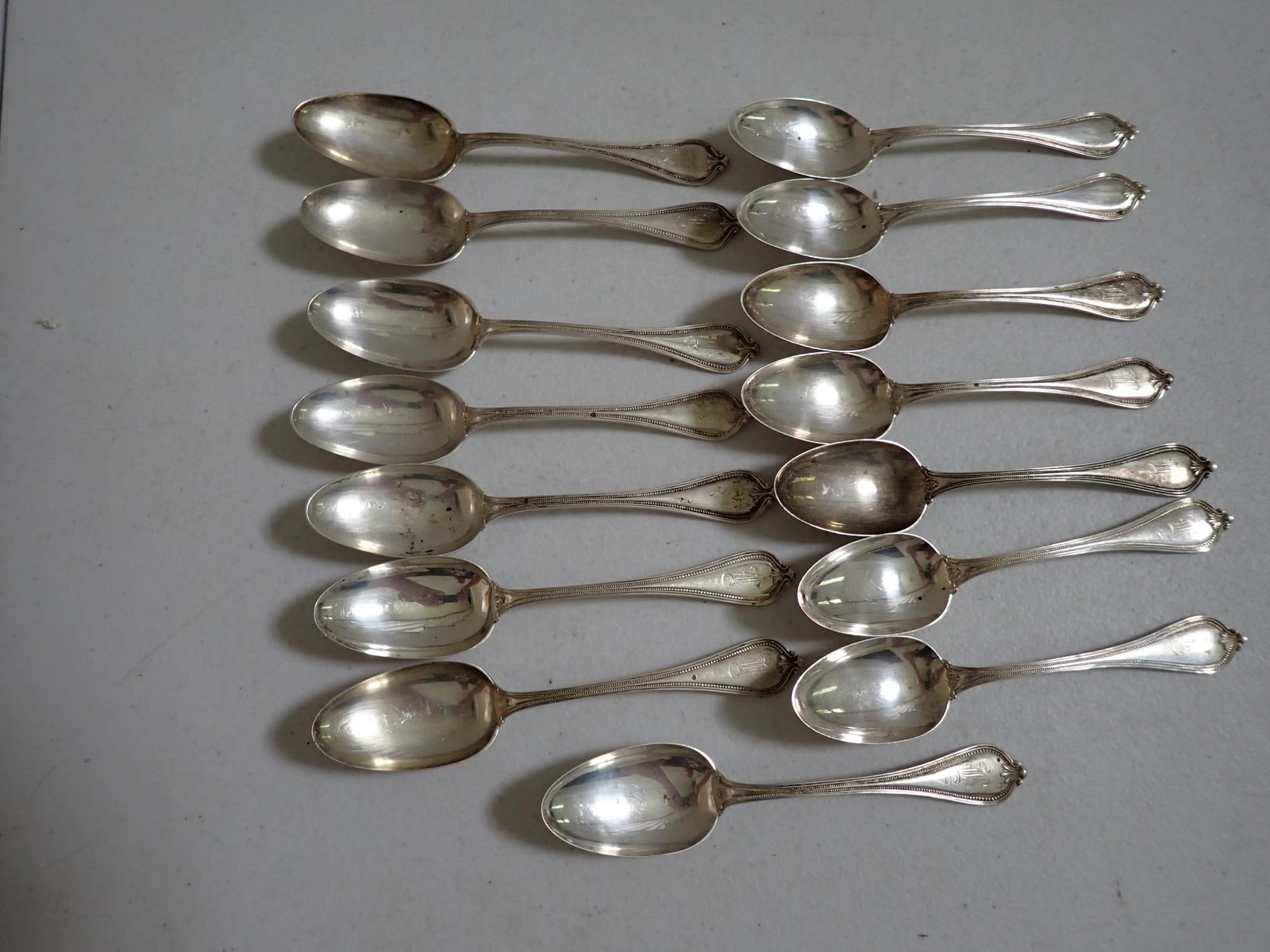 925/1000 Sterling 15 Teaspoons: 10 Monogrammed. 8.8 troy ounces.