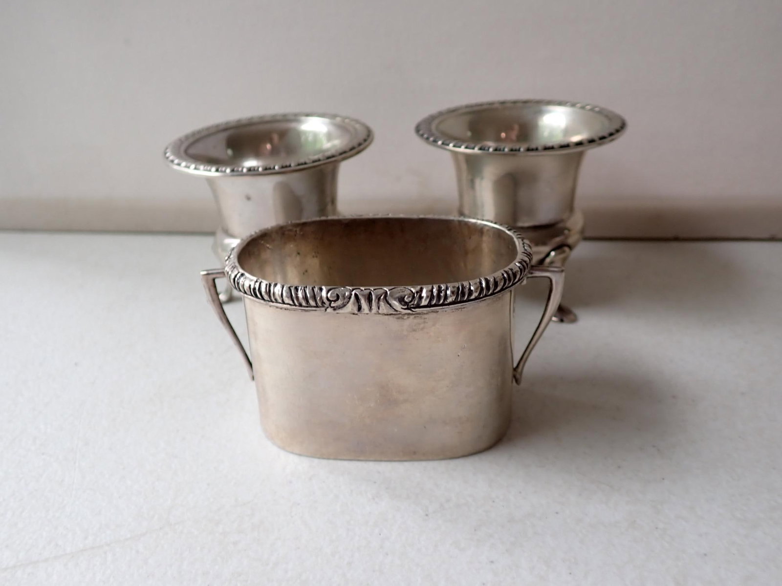 Sanborns Mexico Sterling & Other Holders: Sanborns Mexico Sterling Two Handled Holder and 2 Footed Toothpick Holders. 3" x 2" x 2" high and 2 3/4" diameter x 2 1/2" high toothpicks. 7.1 troy ounces.