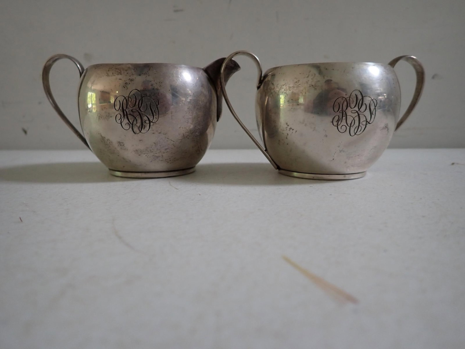 Wallace or Watson Sterling Creamer & Sugar: Appr. 2 1/4" high. Marked Sterling Silver F280. Monogrammed. 6.1 troy ounces.