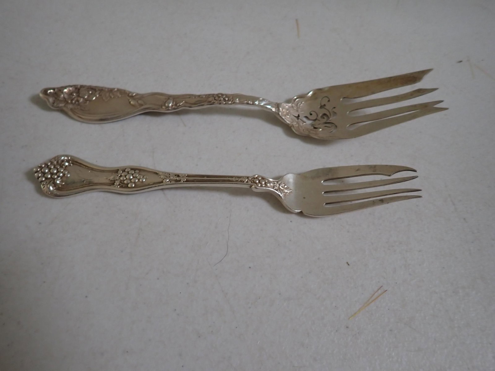 2 Sterling Serving Forks: 7 1/4" Fork Marked Sterling Pat -D 95 w.w. Wailes & Sons. The other is 8 5/8." 4.4 troy ounces.