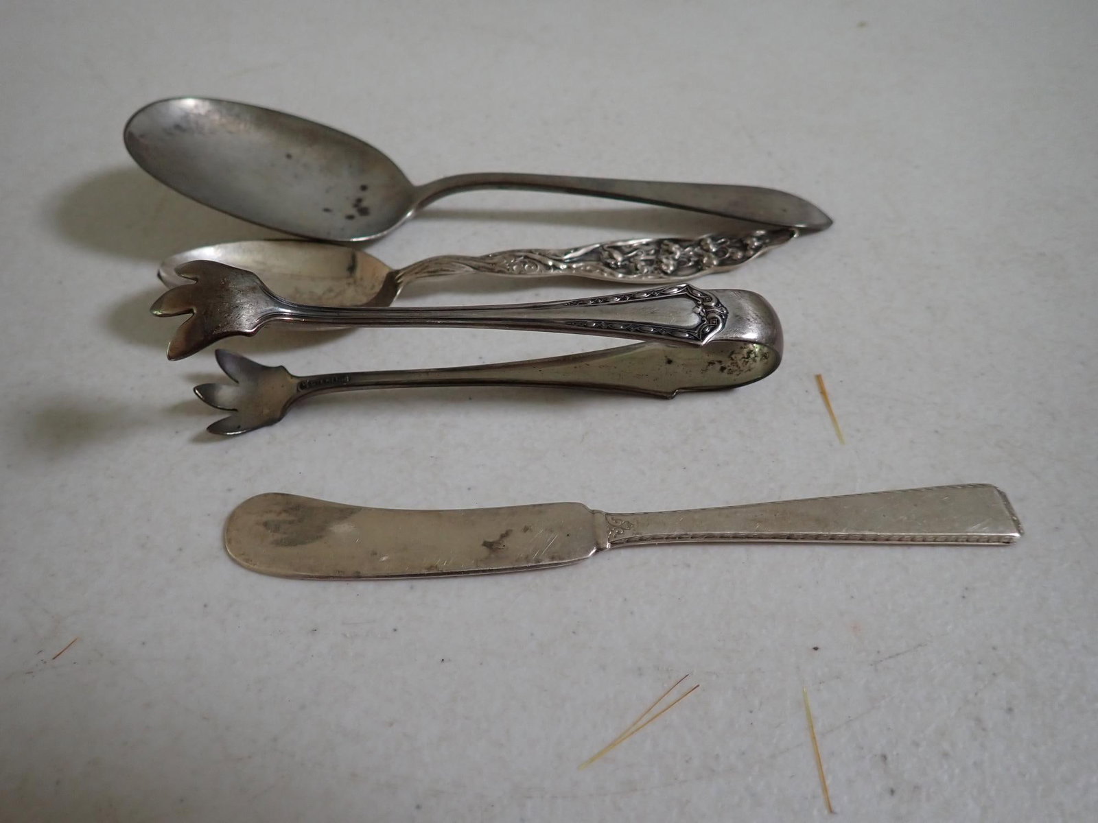 Sterling Silver Tongs, Spoons etc.: Tongs, Serving Spoons & Other Spoons and Butter Knife. 3.9 troy ounces.