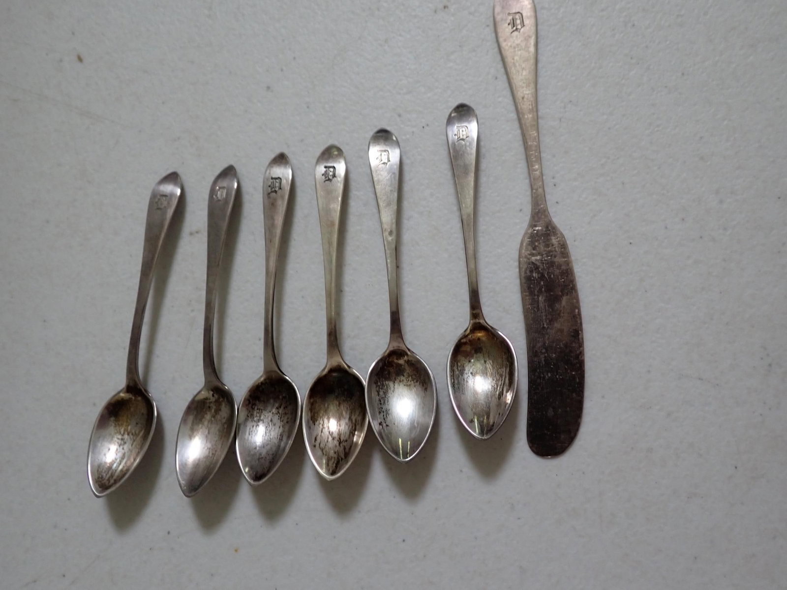 6 Tiffany & Co. Sterling Demitasse Spoons & Butter Knife: 3.2 troy ounces.