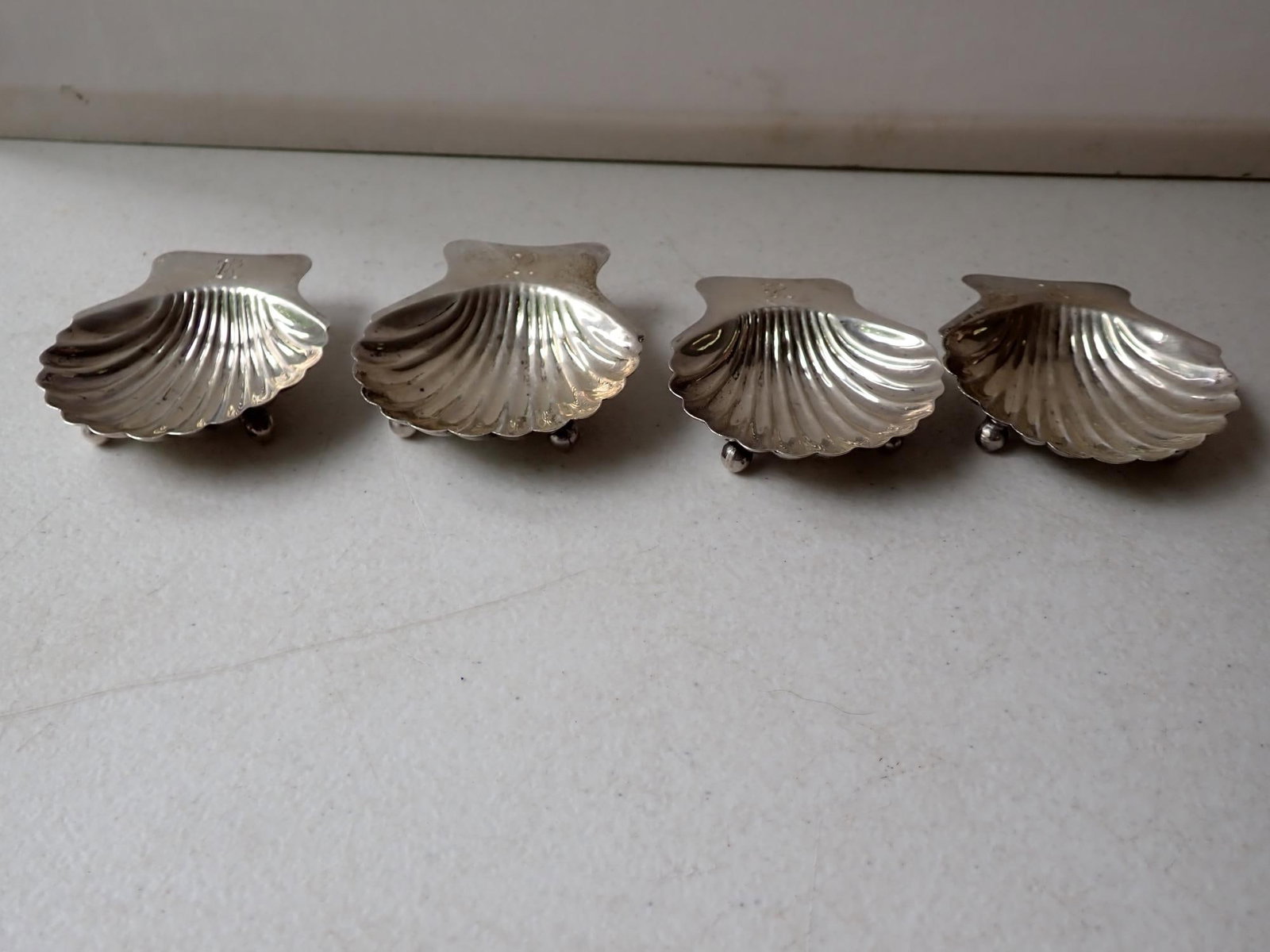 4 Oyster Shell Sterling Footed Dishes: Sterling Mexico - 2 Marked Imagiel. 2 3/4" x 2 1/2" Monogrammed. 3.0 troy ounces.