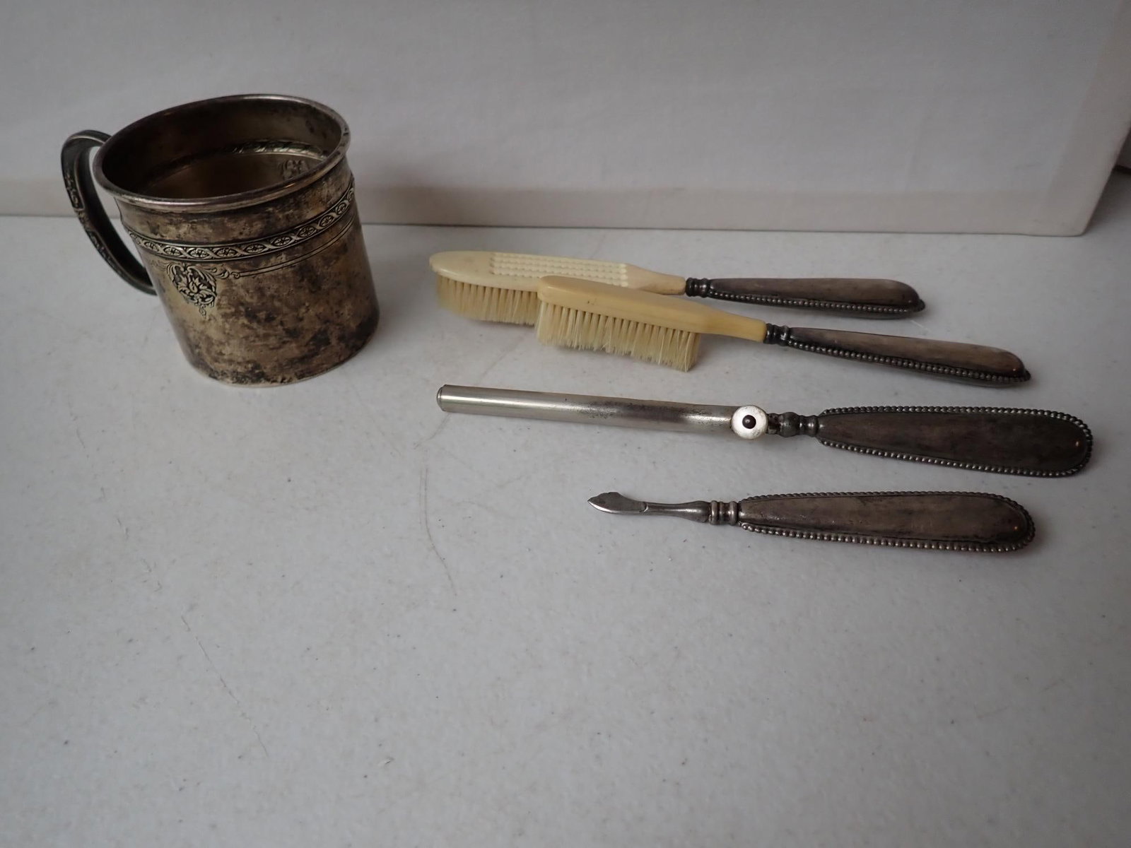 Sterling Towle Mug & Sterling Handle Grooming Set: Grooming set is hollow. Weighed without grooming set. 2.9 troy ounces.