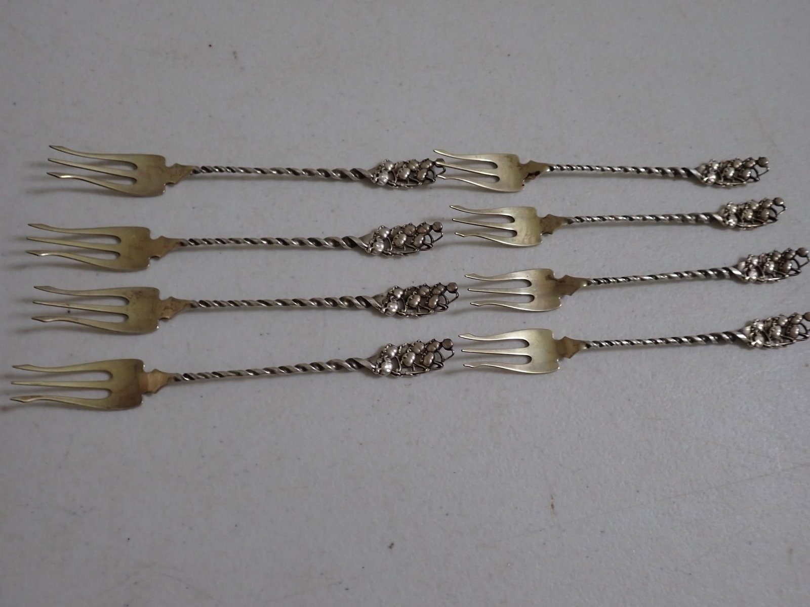 8 Hors D'oeuvres Forks Sterling Silver: Marked 10 Sterling - 2.9 troy ounces.