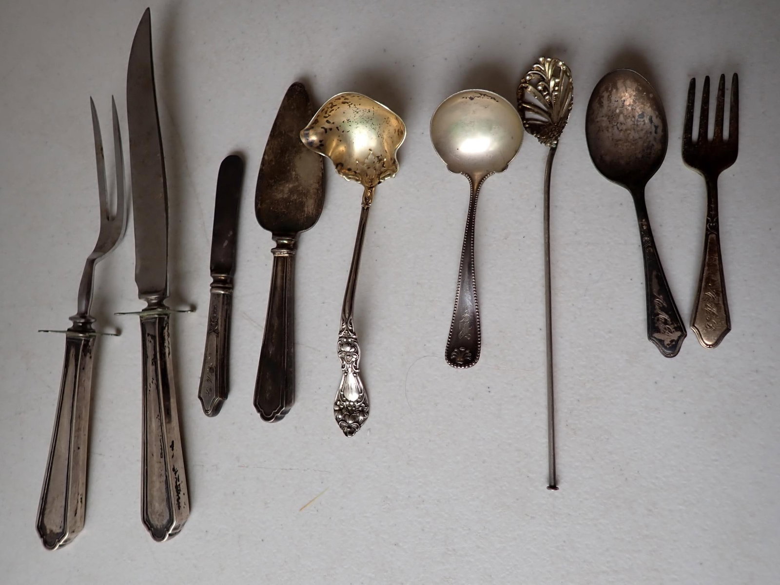 Sterling Ladles, Baby Fork & Spoon & Other Spoon: Other Slotted Spoon. Plus Sterling Handled Serving Pieces not included in weight. 2.1 troy ounces.