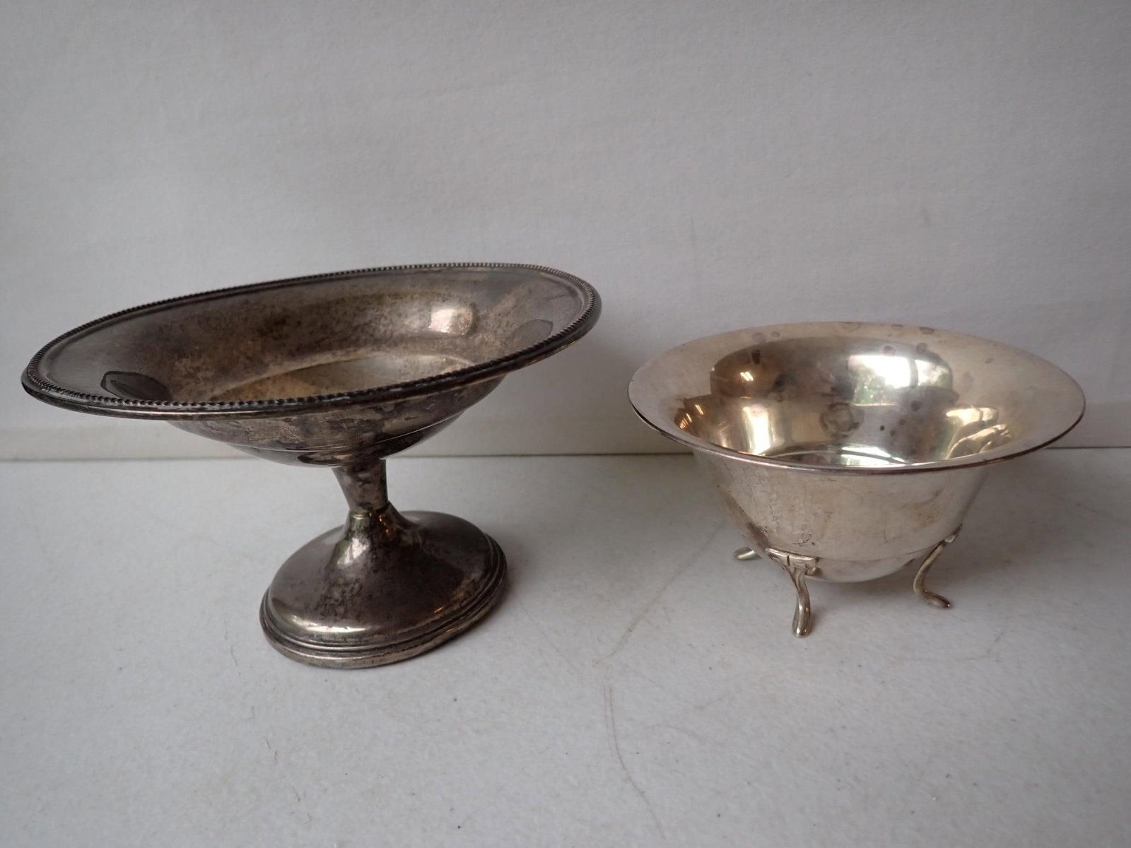 Sterling Silver Footed Bowl and Other Bowl: Footed Bowl marked 311 4 1/8" x 2 1/4". Weighted Pedestal Bowl 5 3/8" x 3". Weight without Weighted piece. 2.0 troy ounces.