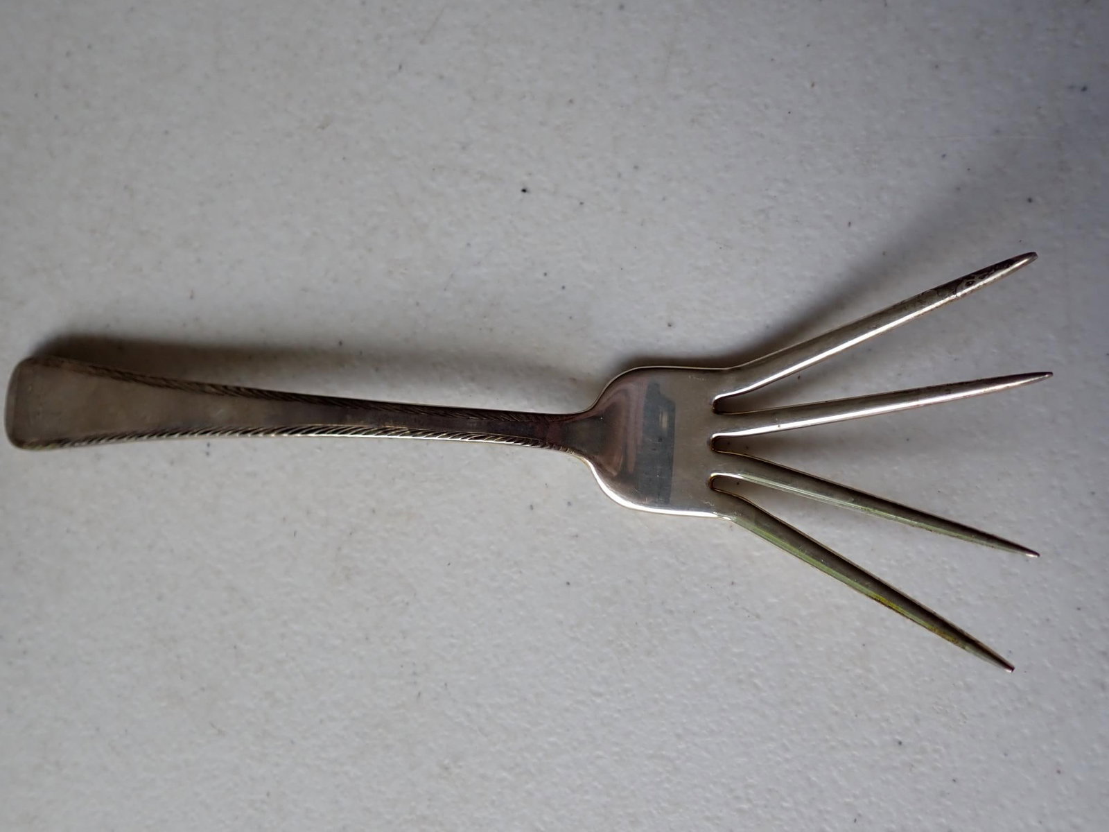 Tuttle Sterling Presidential Hallmark JFK Fork: 4 Spread Tines with Feather edge 7" Presidential Hallmarked JFK. It was made during John F. Kennedy's term of office. 1.7 troy ounces.