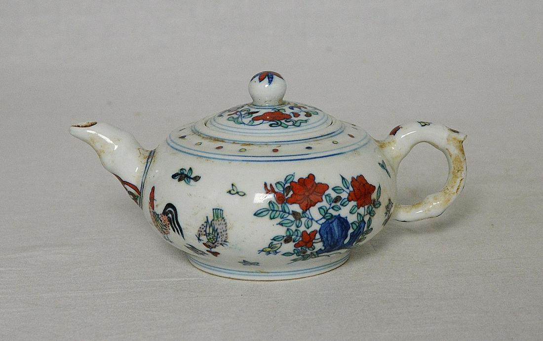 Chinese doucai porcelain teapot: Size: Width 17.1 cm - Height 7.6 cm Materials: Porcelain Time Period: Ming Dynasty Manufactured: Chenghua Origin: China