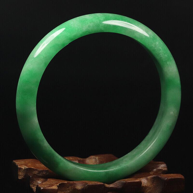 Chinese natural green jade bangle: Size: Width 64 mm - Thickness 8 mm Materials: Natural jade Time Period: qing dynasty Manufactured Date: qing dynasty Origin: China