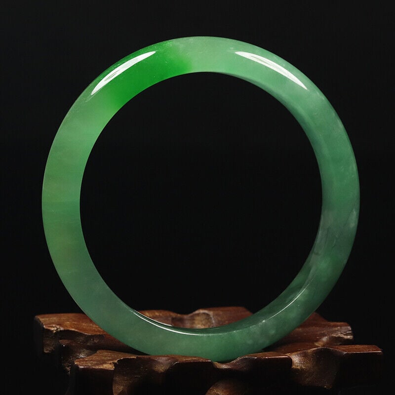 Chinese natural green jade bangle: Size: Width 59 mm - Thickness 7.5 mm Materials: Natural jade Time Period: qing dynasty Manufactured Date: qing dynasty Origin: China