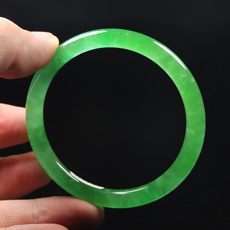 Chinese natural green jade bangle: Size: Width 57 mm - Thickness 7 mm Materials: Natural jade Time Period: qing dynasty Manufactured Date: qing dynasty Origin: China