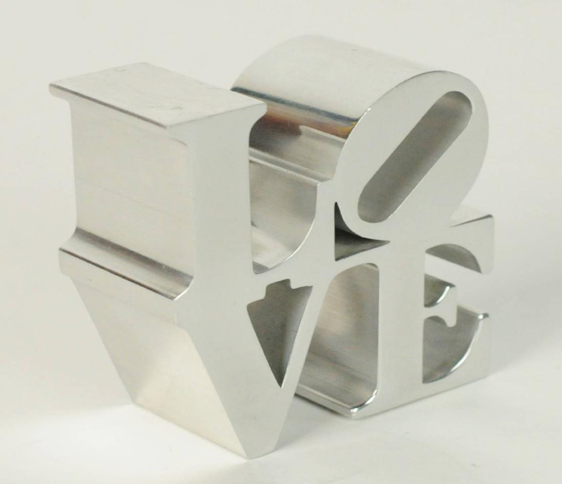 Vintage Robert Indiana "LOVE" Sculpture: Vintage 1970's Robert Indiana "LOVE" Sculpture Paperweight made of Polished Aluminum Sold by MOMA. Measures: 3.25" H x 3.23" W x 1.85 D. Condition: Scratches associated with age. Please examine all ph