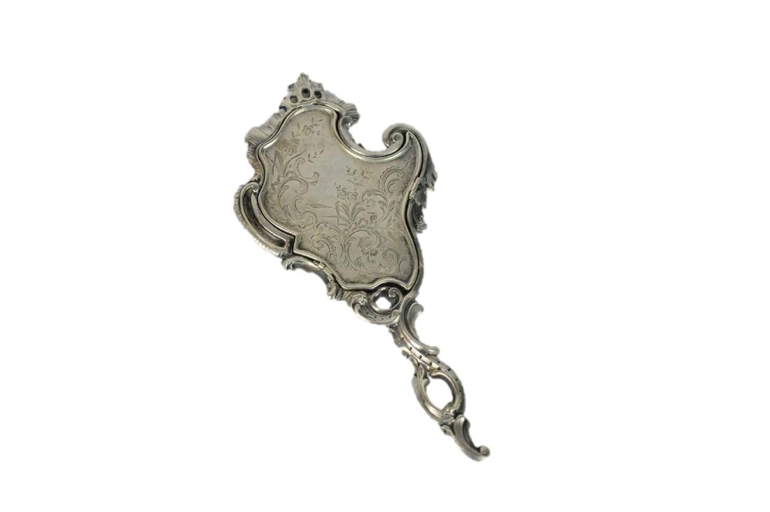 Sterling Silver French Antique Hand Mirror: Sterling Silver ornate French antique hand mirror. Measures: 8.5" L x 4" W. Condition: Good Mirror looks to be replaced. Please examine all photos closely. Contact C. Biddle Auction Gallery for more d