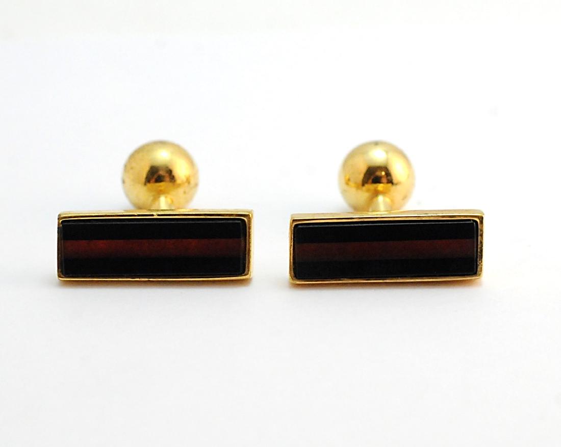 YSL Yves Saint Laurent Cuff Links: YSL, Yves Saint Laurent Cuff Links, gold tone. Condition: surface scratches from normal use. Please examine all photos closely. Contact C. Biddle Auction Gallery for more detailed information. C. Bidd