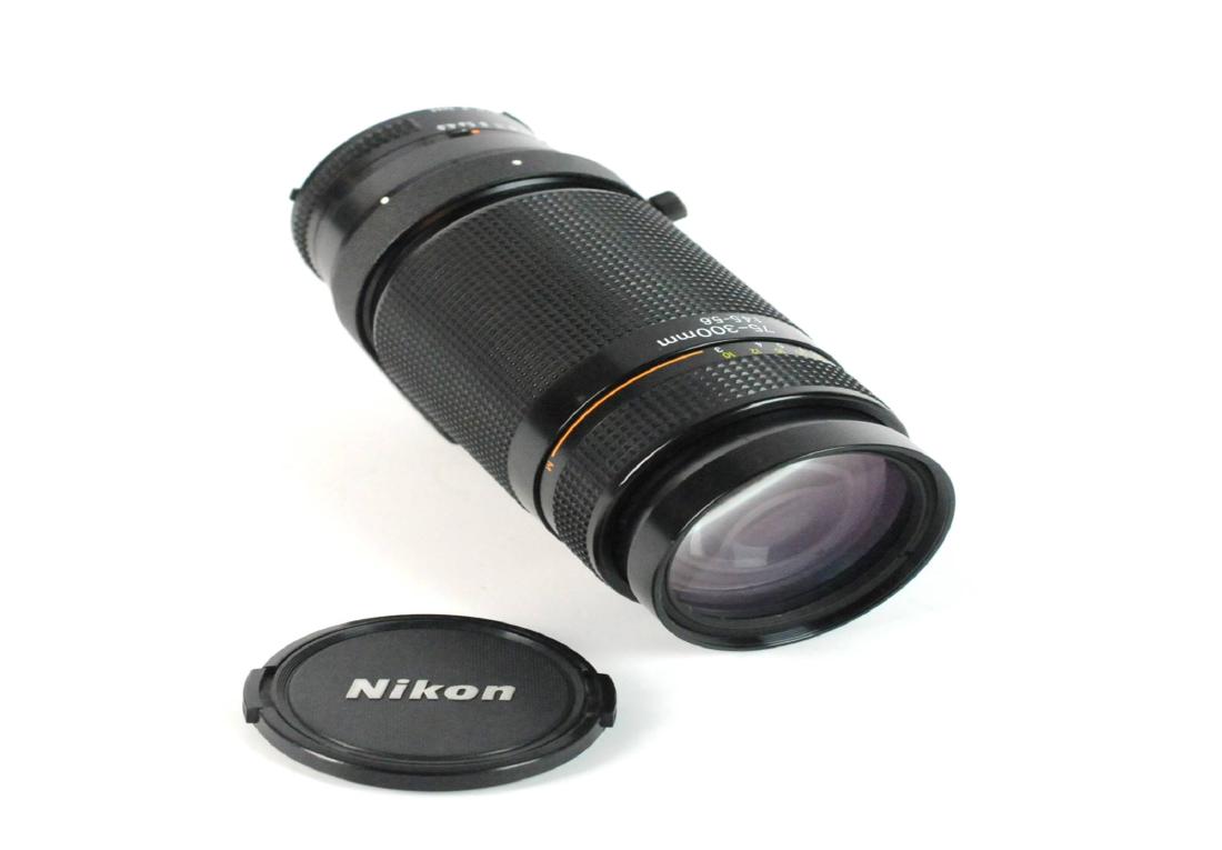 Nikon Telephoto 75-300mm Nikkor Autofocus Lens: Nikon Zoom Telephoto 75-300mm f/4.5-5.6 AF Zoom Nikkor Autofocus Lens with Filter & Lens covers. Tripod collar provides 360Â° rotation. Being sold as is. Please examine all photos closely. Contact C