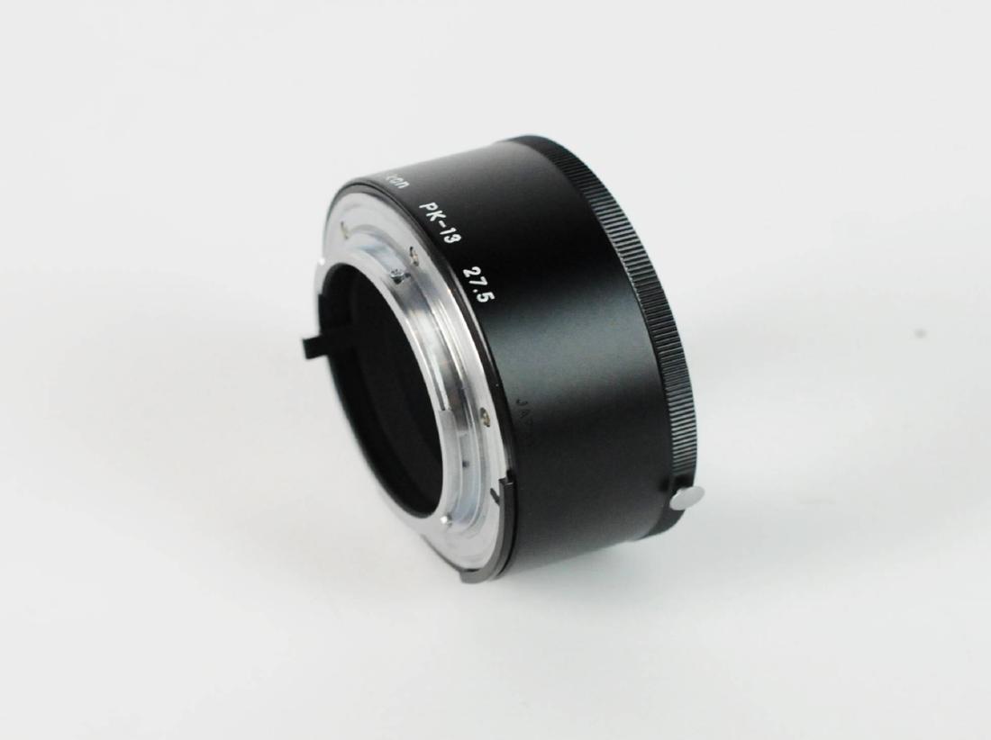 Nikon PK-13 27.5mm AI Extension Tube: Nikon PK-13 27.5mm AI Extension Tube provides 27.5mm of extension. Enables a lens to focus closer then the normal set minimum focusing distance. Sold As Is. Please examine all photos closely. Contact