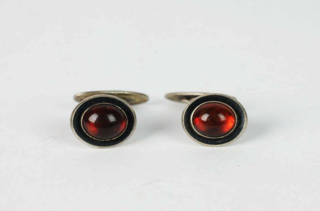 N.E. From Sterling Danish Amber Cufflinks: N.E. From, Denmark, Sterling Amber Cufflinks. 10mm amber cabochon. Weight: 13.2 grams. Please examine all photos closely. Contact C. Biddle Auction Gallery for more detailed information. C. Biddle Auc