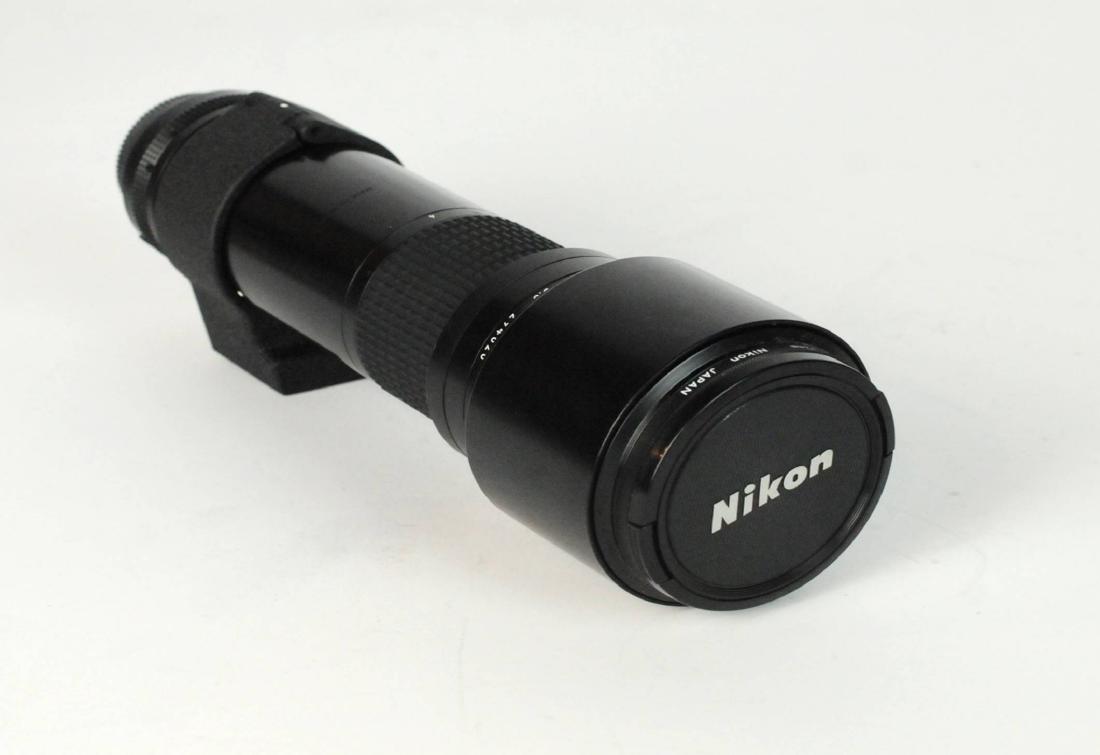 Nikon Nikkor AIS 400mm F/5.6 EDManual Focus Lens: Nikon Nikkor AIS 400mm F/5.6 ED IF Manual Focus Lens (72). Sold As Is. Includes vintage leather case. Case shows wear. Please examine all photos closely. Contact C. Biddle Auction Gallery for more det