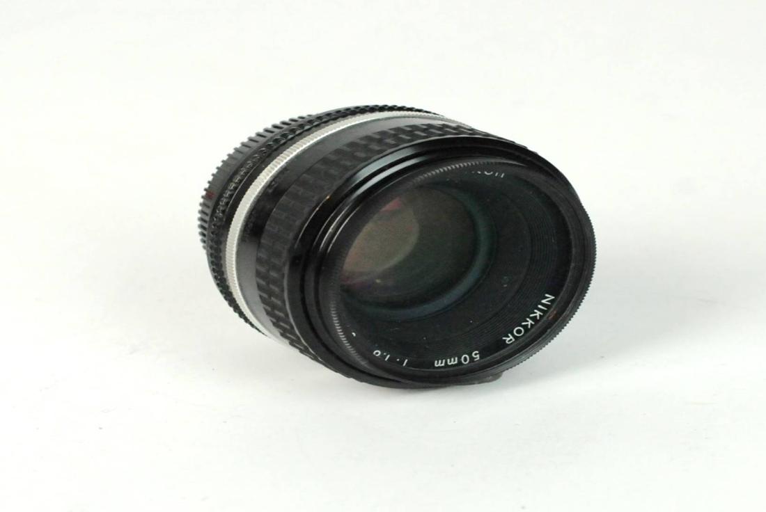 Nikon 50mm 1:1. Lens & L37c Glass Filter: Nikon Lens 50mm 1:1.8 Lens Close Focus with Nikon L37c Glass Filter. Being sold As Is. Please examine all photos closely. Contact C. Biddle Auction Gallery for more detailed information. C. Biddle Auc