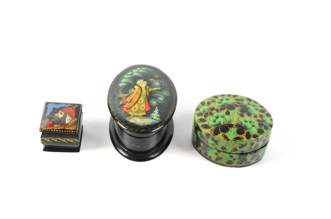 3 Russian Hand Painted Lacquer Trinket Boxes: 3 Russian hand painted lacquer trinket boxes. A: Magician 3"L x 2"W. B: Green Flowers 2.25"L x 1.75"W. C: Warrior Face 1.25" x 1.25". Condition Good. Please examine all photos closely. Contact C. Bidd
