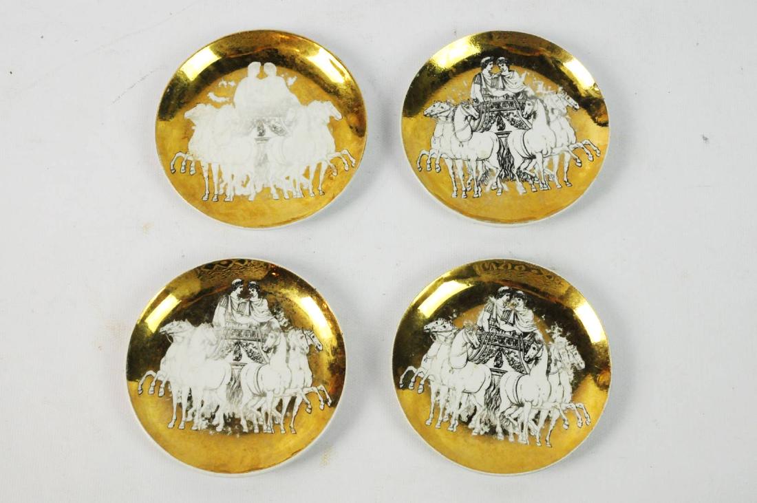 Fonasetti Milano Gold Pin Dish Plates: Fonasetti Milano gold pin dishes with a horse and chariot design. Size: 4". Condition: surface scratches and wear on pattern. Please examine all photos closely. Contact C. Biddle Auction Gallery for m