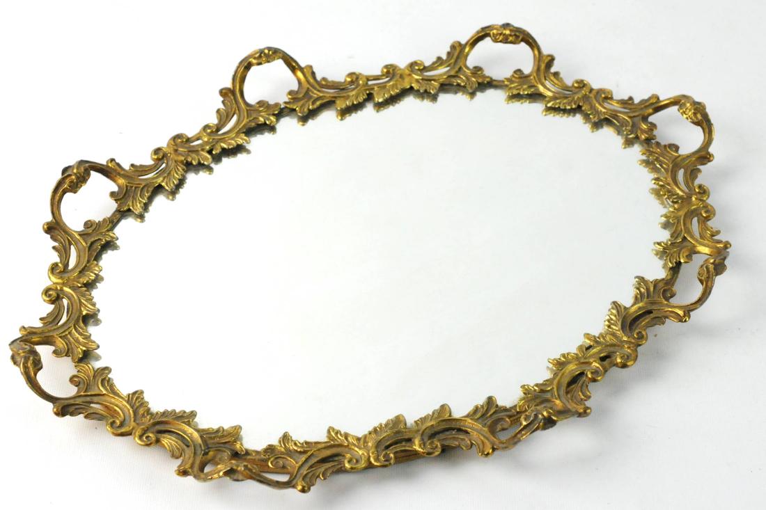 Ornate Brass Vanity Dresser Mirror Tray: Ornate brass vanity tray with mirror center. Measures:16"L x 10.5"W. Condition: Very Good. Please examine all photos closely. Contact C. Biddle Auction Gallery for more detailed information. C. Biddle