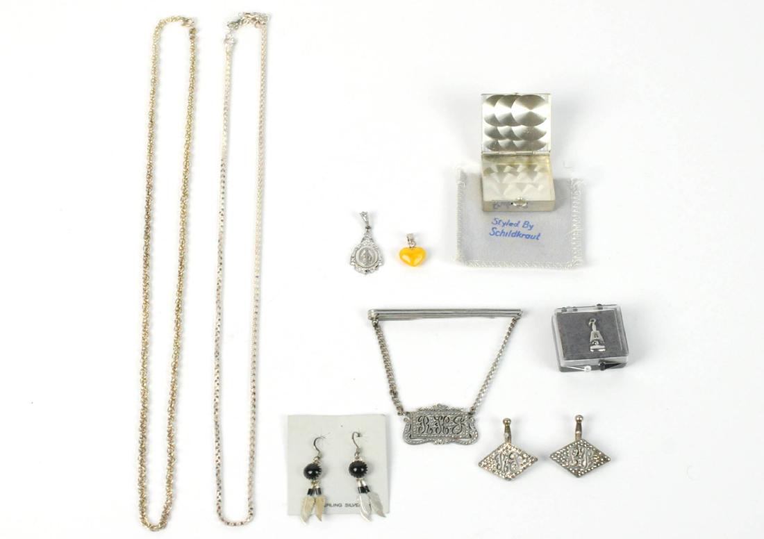 Sterling Silver LOT Chains, Pill Box, Earrings: A sterling silver lot including: A: Schildkraut pill box. B: Charm of a gavel with an "A", C: Rope chain 24"L. D: Fancy chain 24"L, E: Feather earring with onyx - Shepard's hooks for pierced ears. F: 